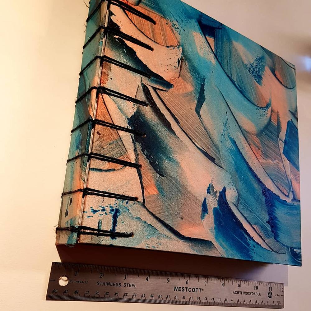 Madeleine RousseauBook binding project that includes some printmaking, calligraphy (sumi ink and folded pen), paste paper making and a book binding technique called secret Belgian binding.